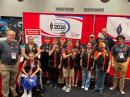 Members of the Rambler Radio Club, W4LMS, from Lafayette, Georgia, joined ARRL staff members Josh Johnston, KE5MHV (left), and Max Freedman, N4ML (right), at the hamfest. The middle school club members are all radio amateurs.